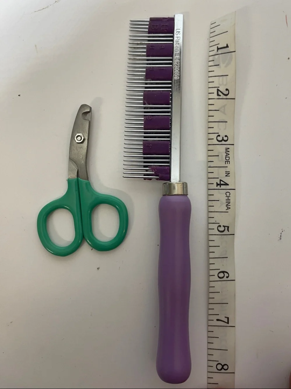3/$10 Purple-Handled Pet Comb with Green Pet Nail Scissors